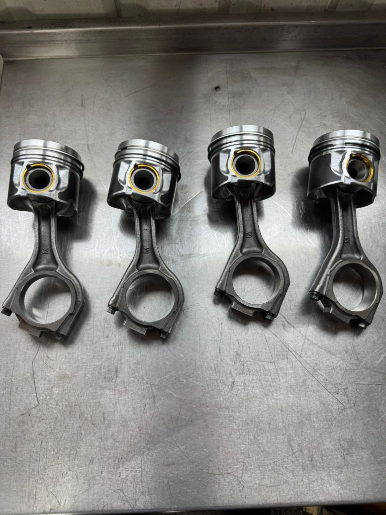 Pistons and connecting rods on the workbench