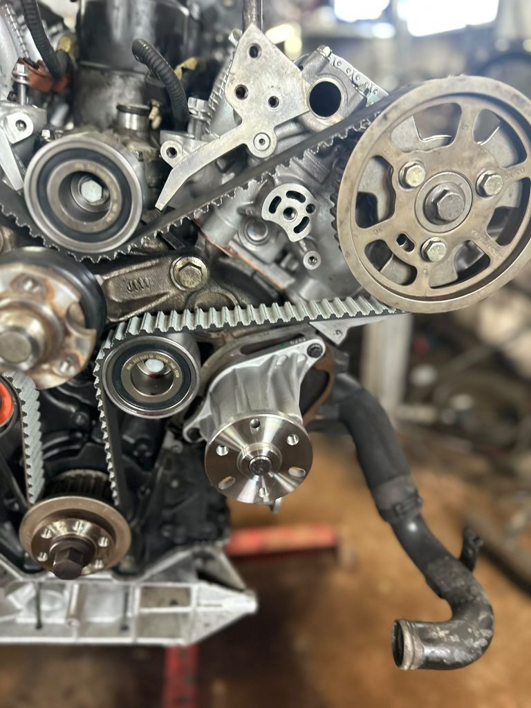 Close-up of timing belt and pulleys